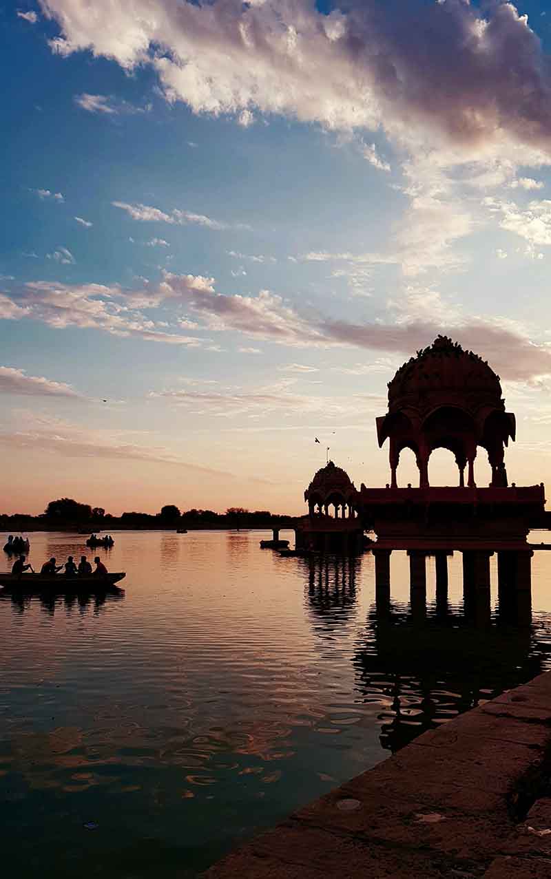 cenotaphs or canopies or marble chhatri - a common sight in Rajasthan against the backdrop of a natural lake