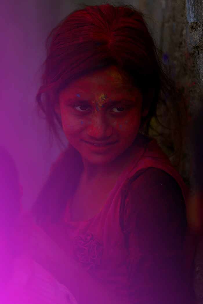 Festival of Colours- Holi celebration. An indian girls decked in gulaal.