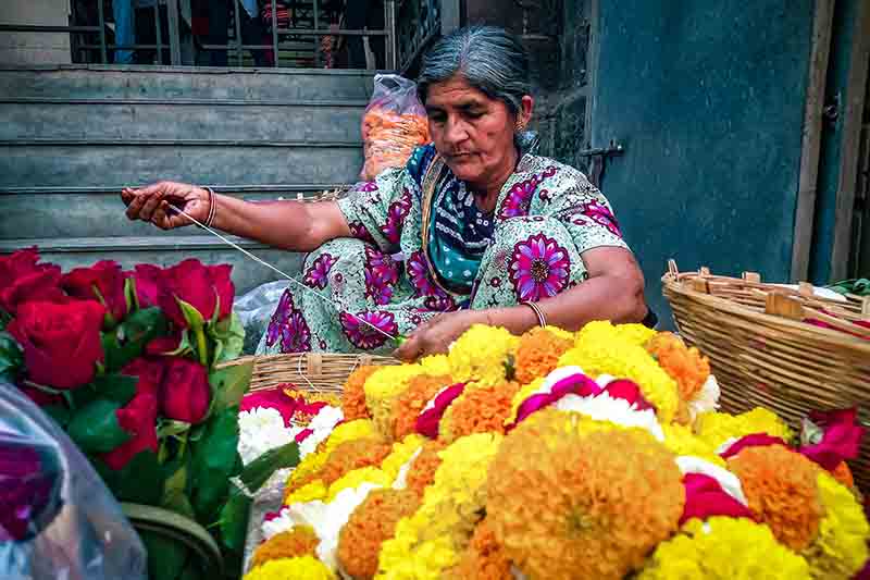 An old Gujarati woman making flower garland I An Indian flower seller in the villages of Gujarat I Hindu temple