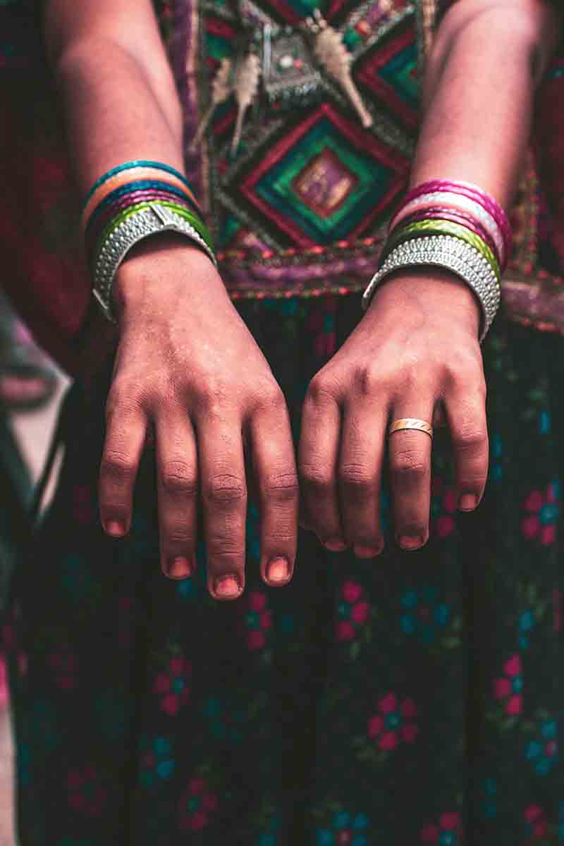 Traditional & Tribal Jewellery of Gujarat I Metal Jewellery Of Gujarat I woman wearing colourful Indian attire